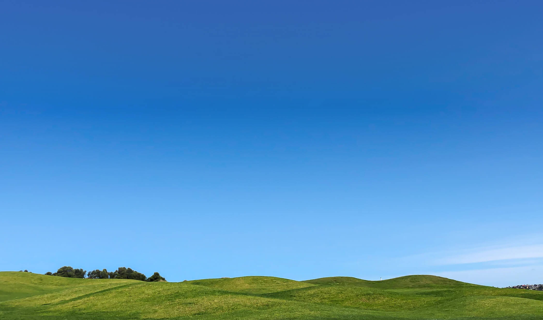 green hills with blue sky